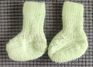 Hand knitted green socks newborn